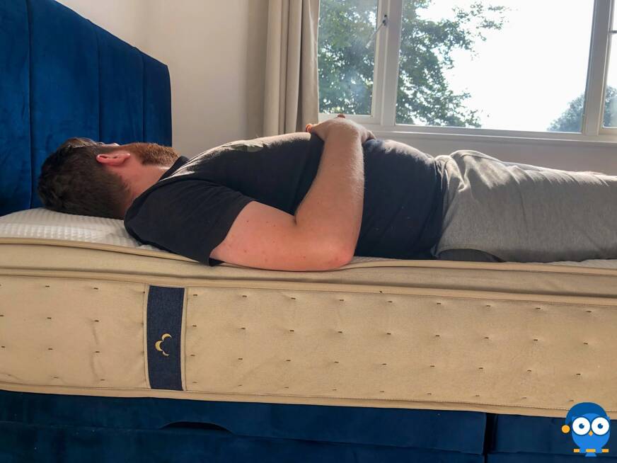 Man laying on back on DreamCloud mattress